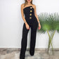 Mouwloze jumpsuit met wijde pijpen en knoopversiering