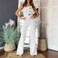 Mouwloze jumpsuit met wijde pijpen en knoopversiering