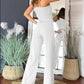 Mouwloze jumpsuit met wijde pijpen en knoopversiering