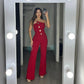 Mouwloze jumpsuit met wijde pijpen en knoopversiering