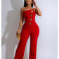 Mouwloze jumpsuit met wijde pijpen en knoopversiering
