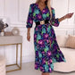 Elegante damesjurk met bloemendruk, v-neck en zijspleet