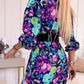 Elegante damesjurk met bloemendruk, v-neck en zijspleet