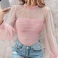 Transparante top met faux parels en lantaarnmouwen