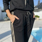 Damesjas met capuchon en broek met trekkoord
