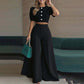 Set bestaande uit een elegante crop top met pofmouwen en een broek met wijde pijpen