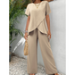Casual outfit voor dames met een asymmetrische top en een broek met wijde pijpen