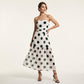 Elegante strapless jurk met stippen en gelaagde rok
