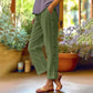 Casual effen cropped broek met losse pasvorm en knopen aan de zijkant
