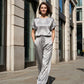 Set bestaande uit een elegante top en een broek met wijde pijpen voor dames