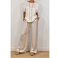 Set bestaande uit een elegante top en een broek met wijde pijpen voor dames