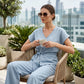 Set bestaande uit een casual dames-top met strik in de taille en een broek met wijde pijpen